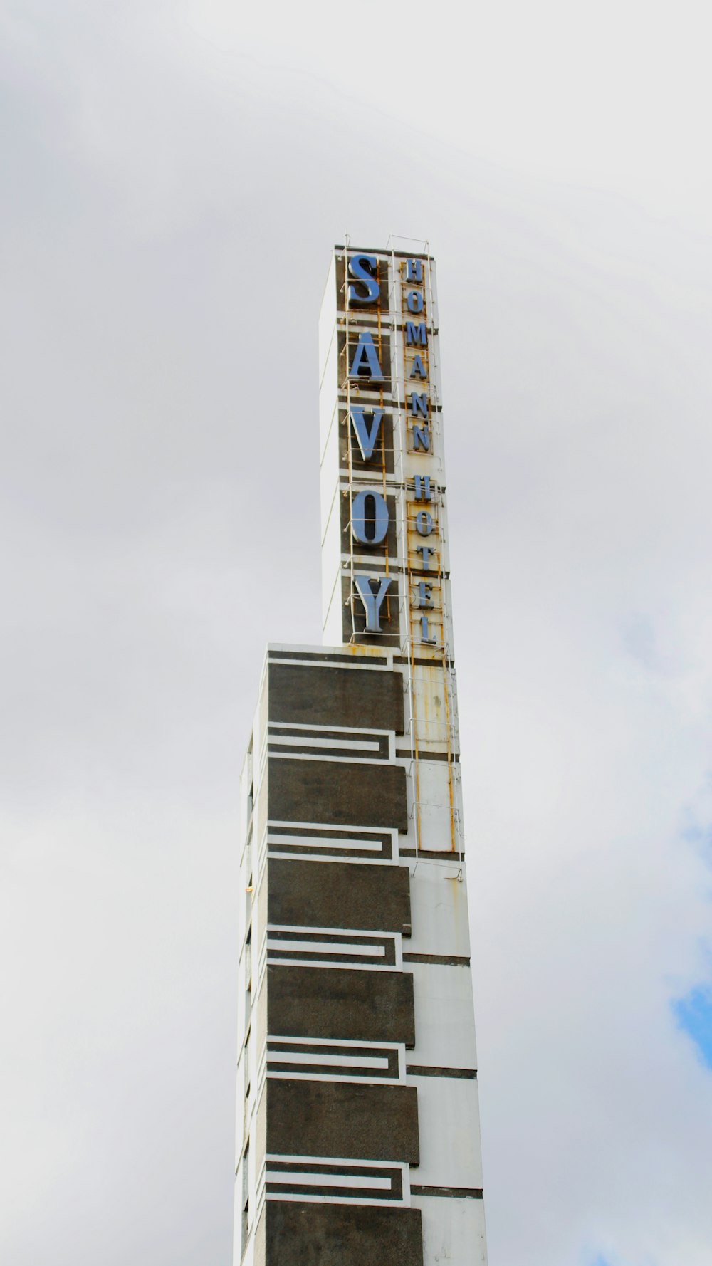 a tall building with a sky background