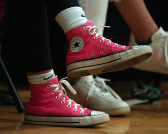 pair of pink sneakers of student in middle school