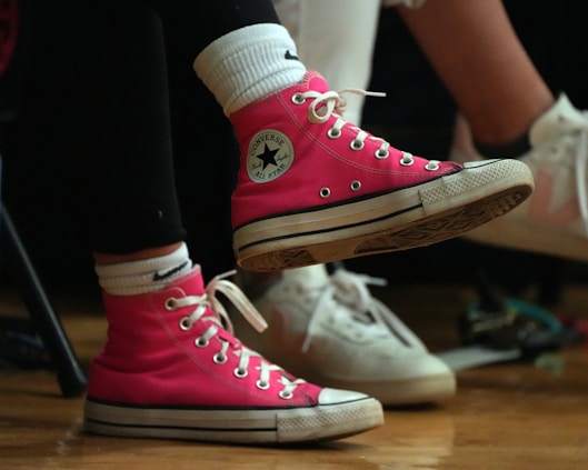 pair of pink sneakers of student in middle school