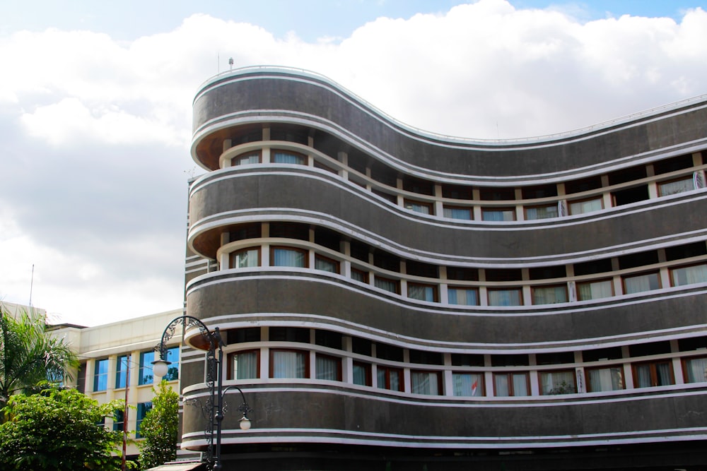 a large building with a curved design on the side of it