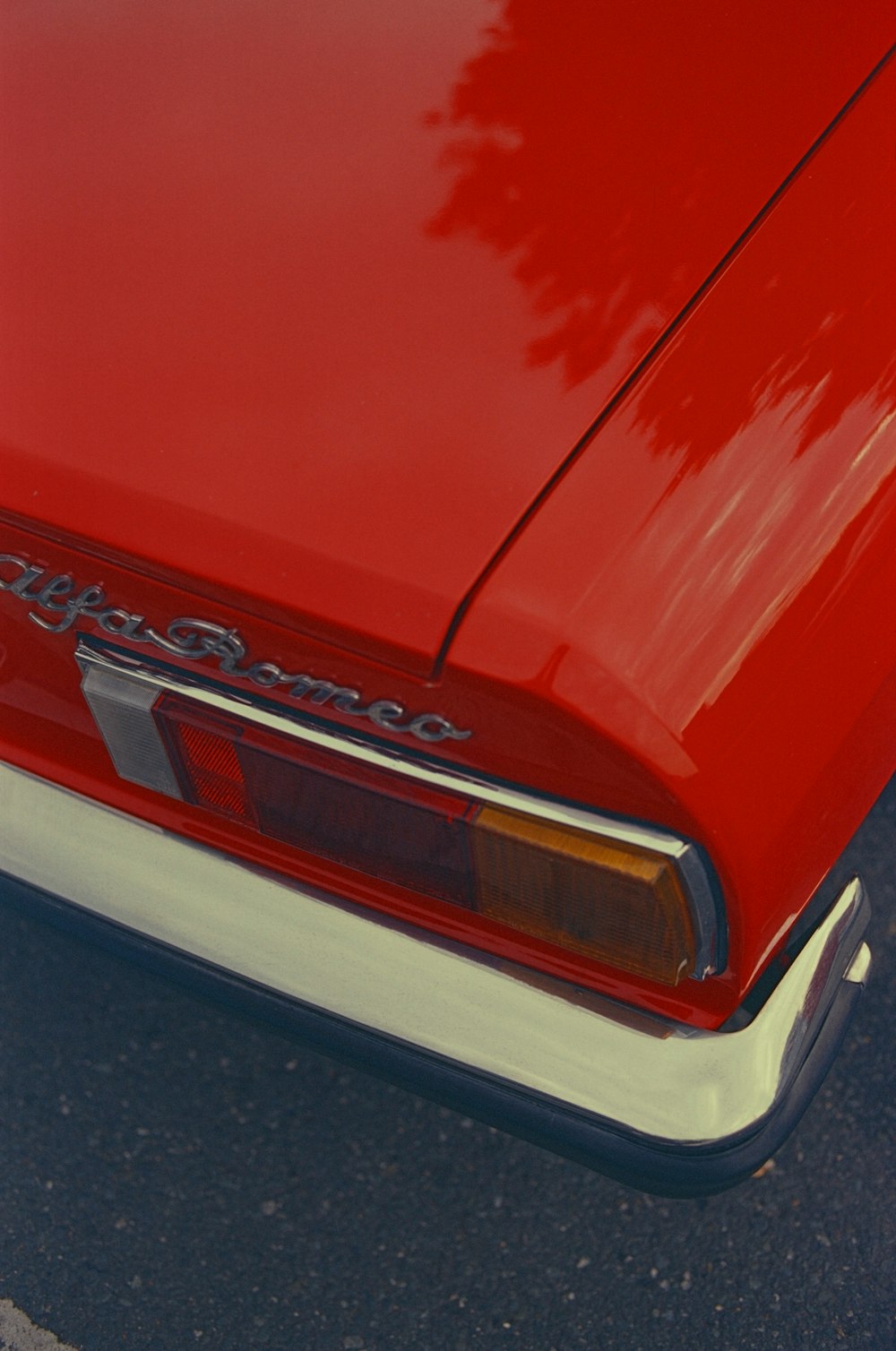 a red car parked in a parking lot