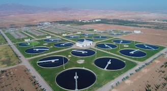 an aerial view of a large field of water tanks