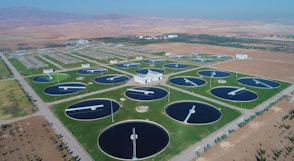 an aerial view of a large field of water tanks