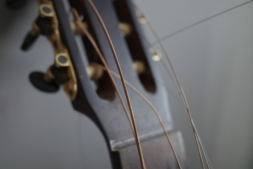 a close up of the strings of a guitar