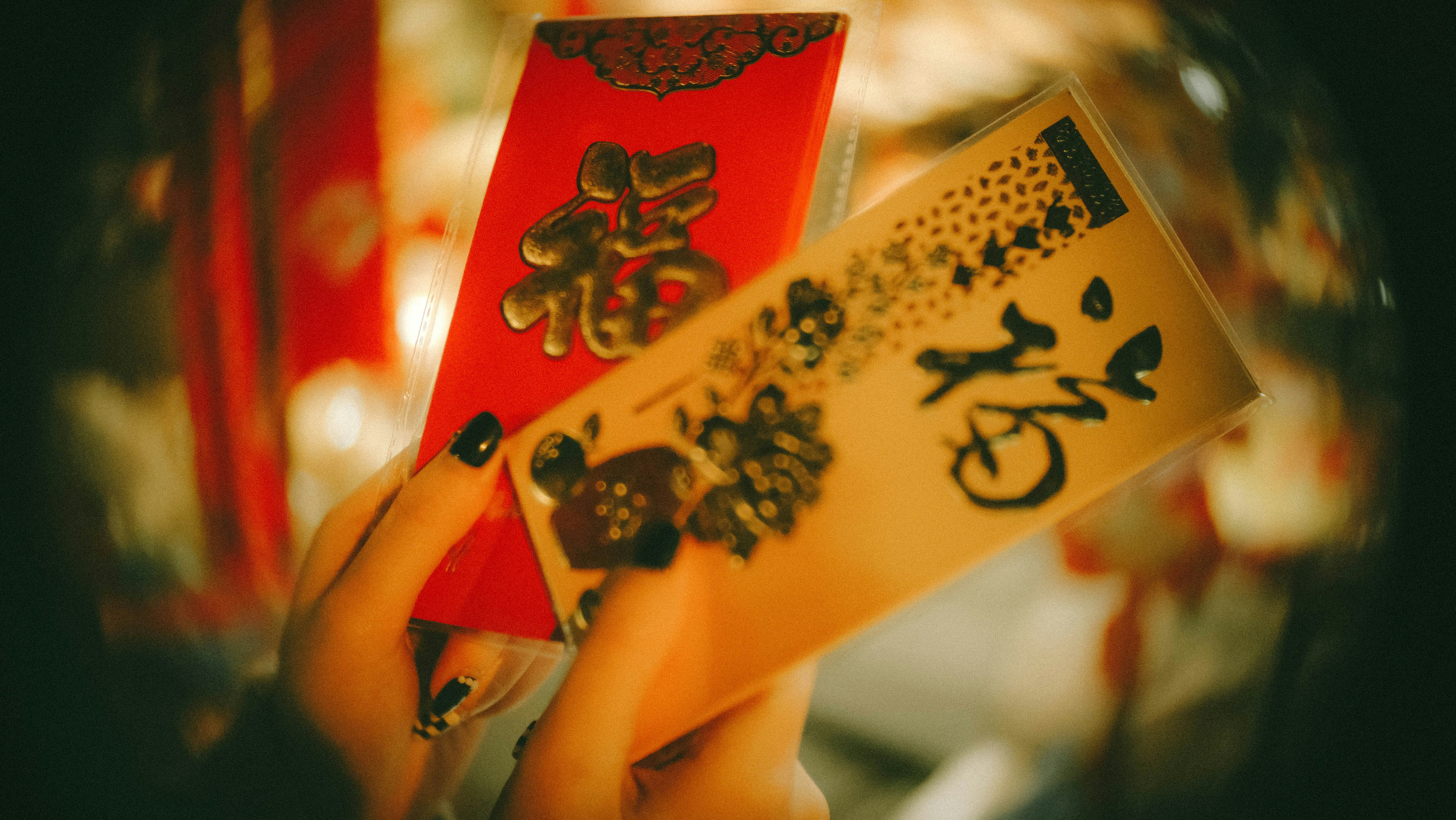 a close up of a person holding a piece of paper