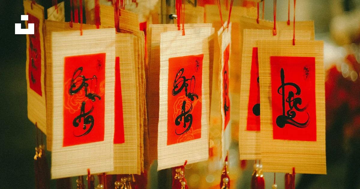 A display of chinese calligraphy hanging from strings photo – Free Text ...