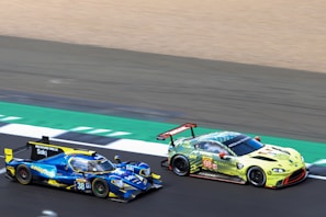 NASCAR cars racing side-by-side on a high-speed oval track