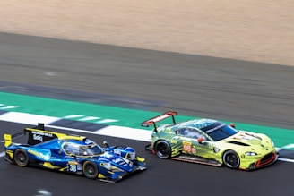 NASCAR cars racing side-by-side on a high-speed oval track