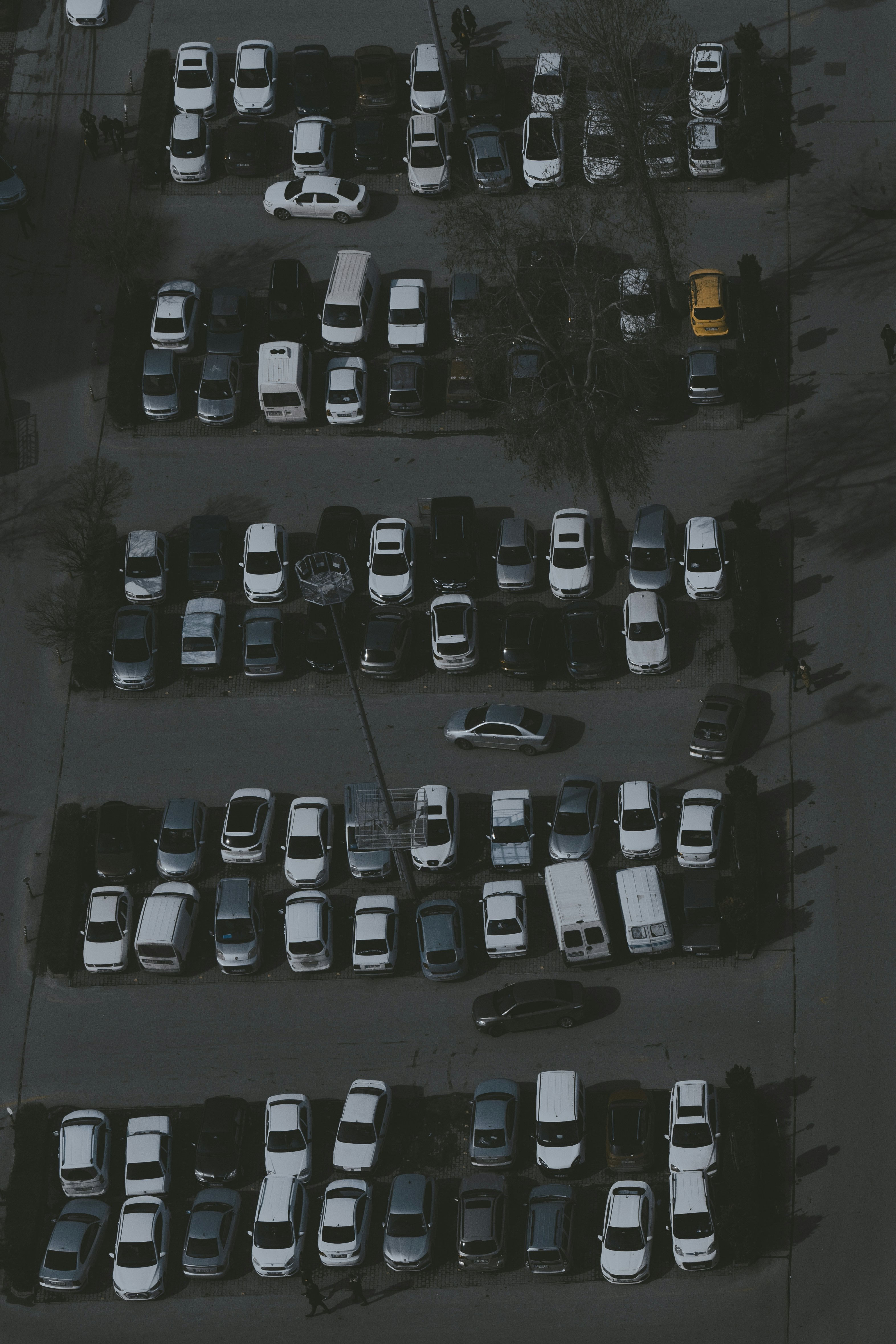 a parking lot filled with lots of parked cars