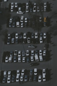a parking lot filled with lots of parked cars