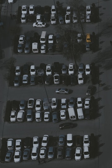 a parking lot filled with lots of parked cars