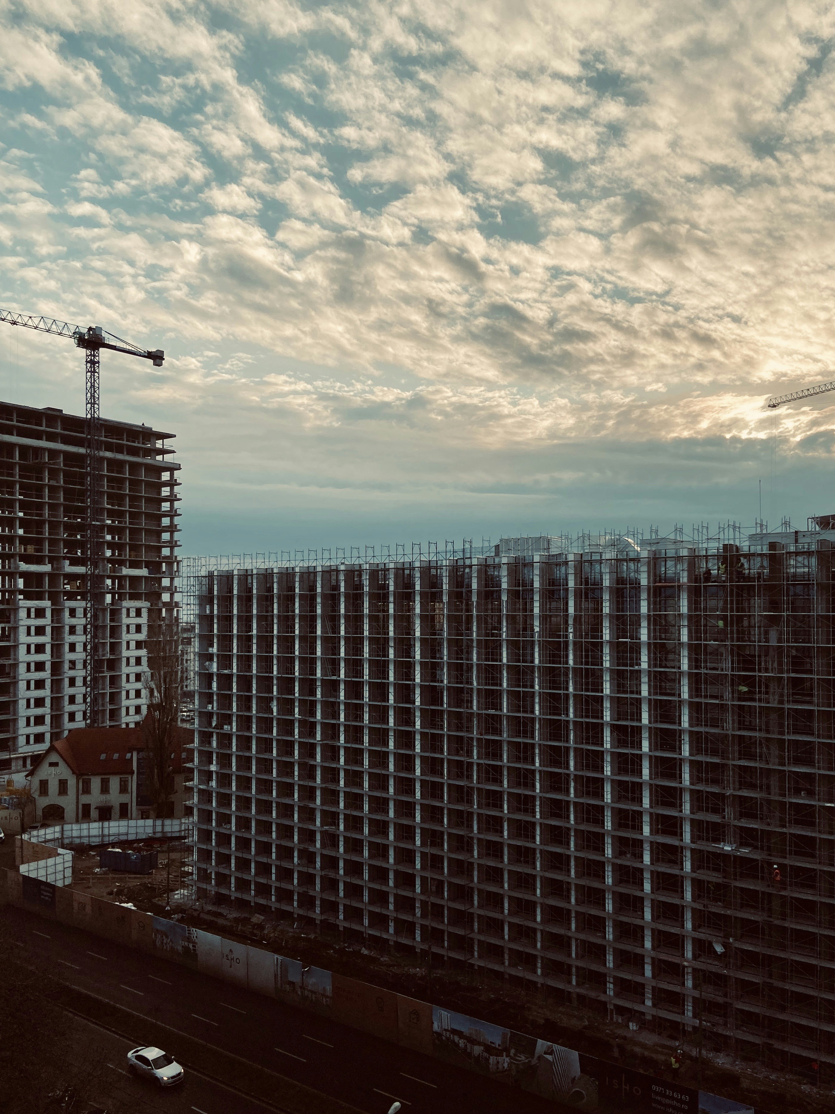 a building under construction with a crane in the background
