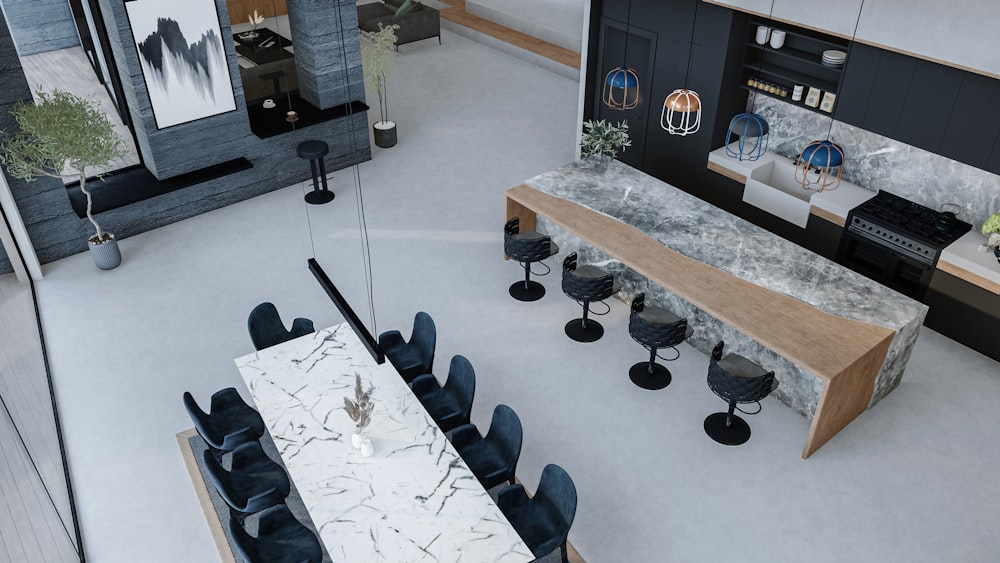 a large dining room with a marble table and black chairs