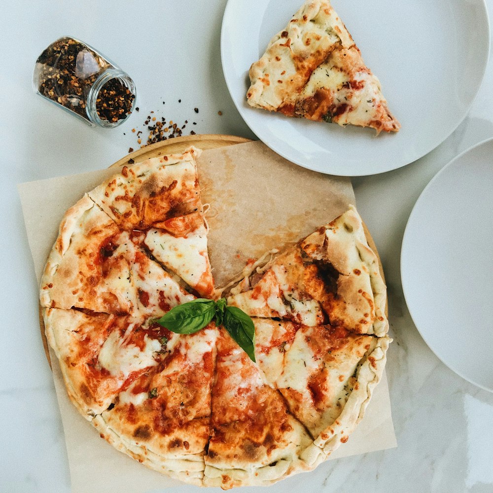 a pizza sitting on top of a wooden cutting board