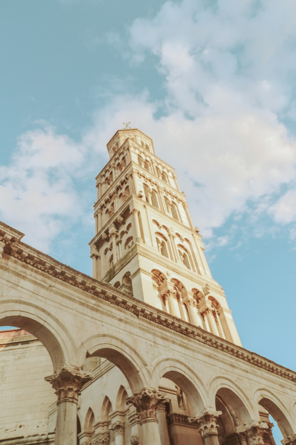 a tall clock tower towering over a city