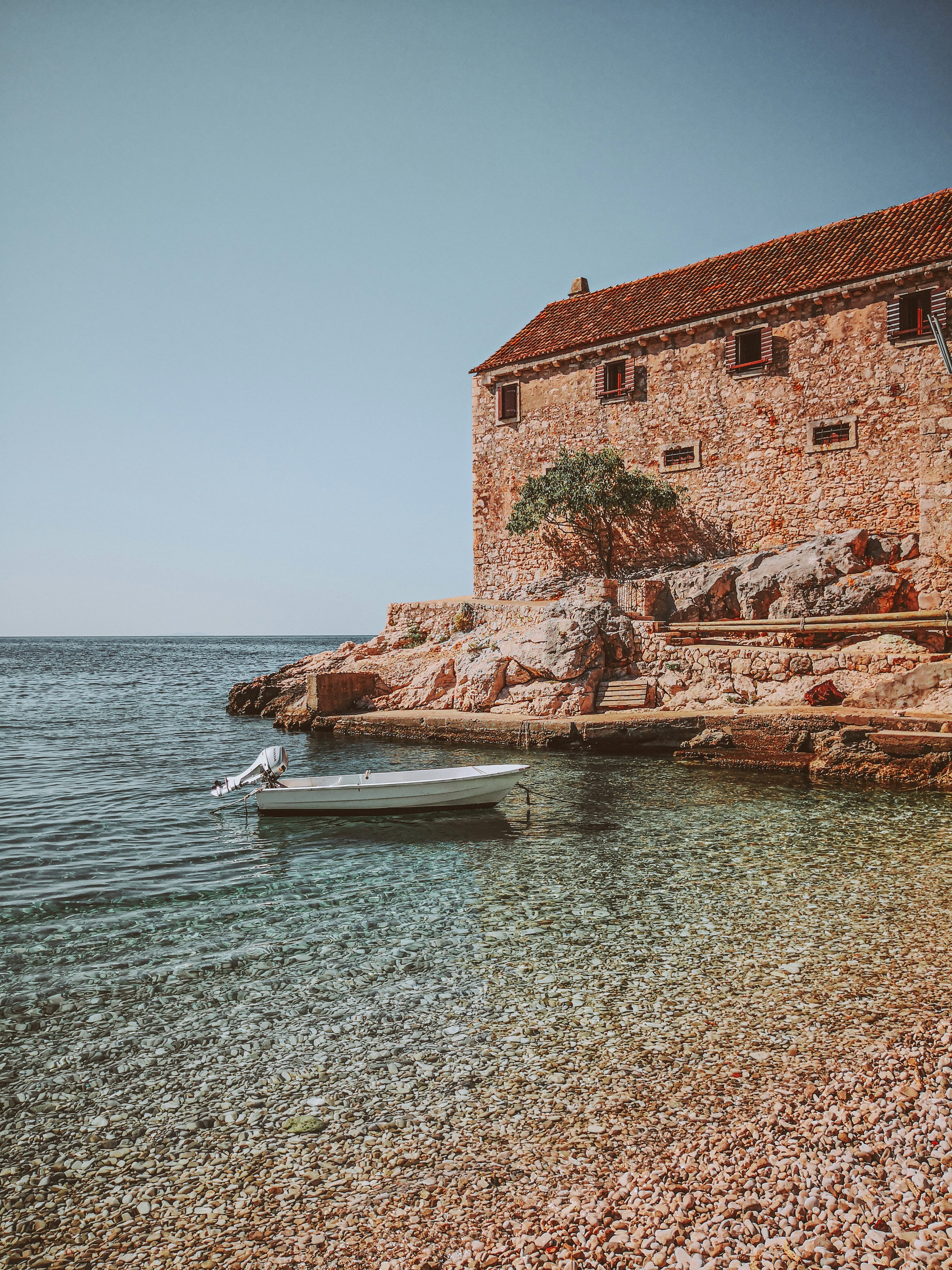 a boat sitting on top of a body of water