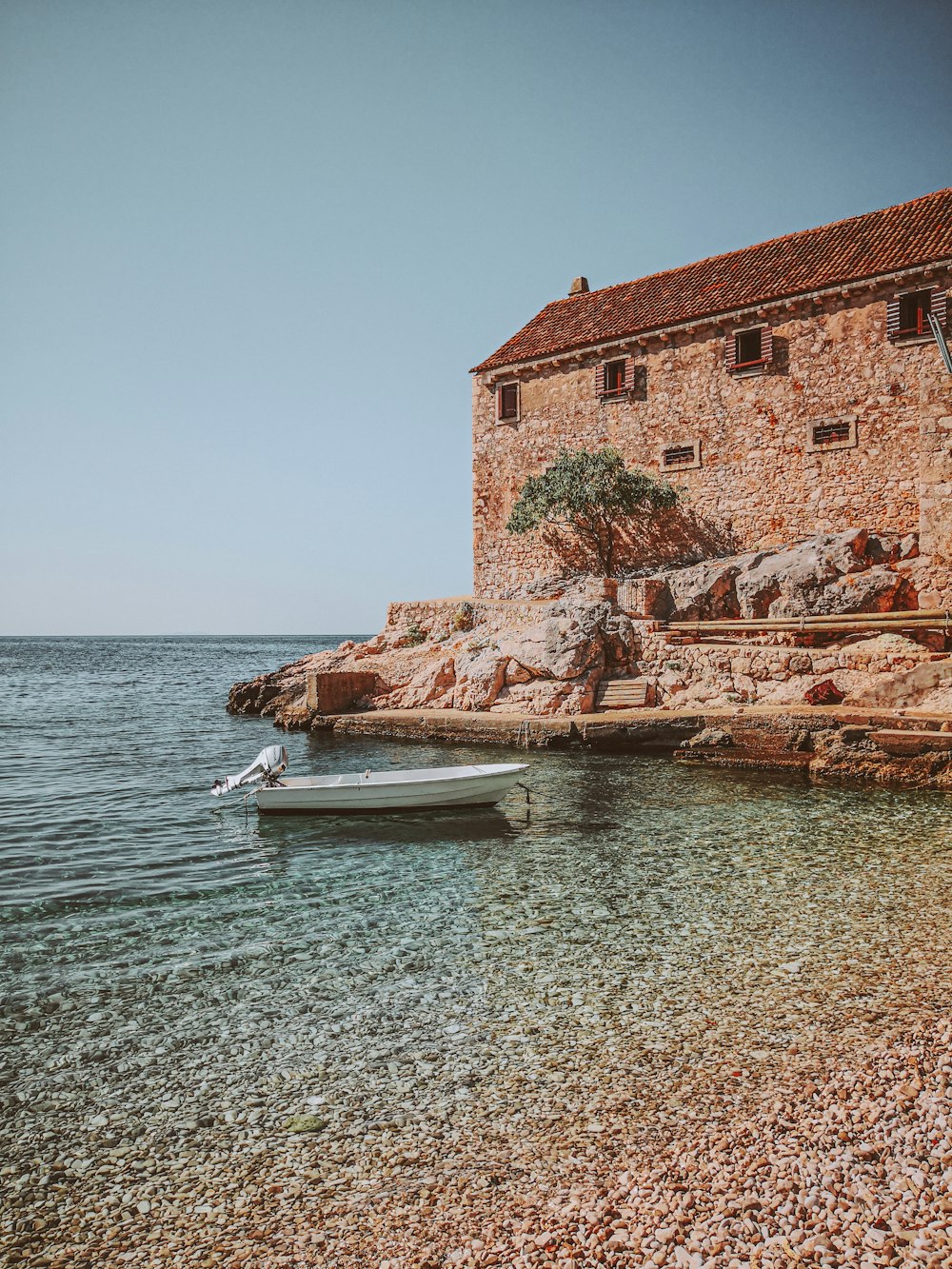 a boat sitting on top of a body of water