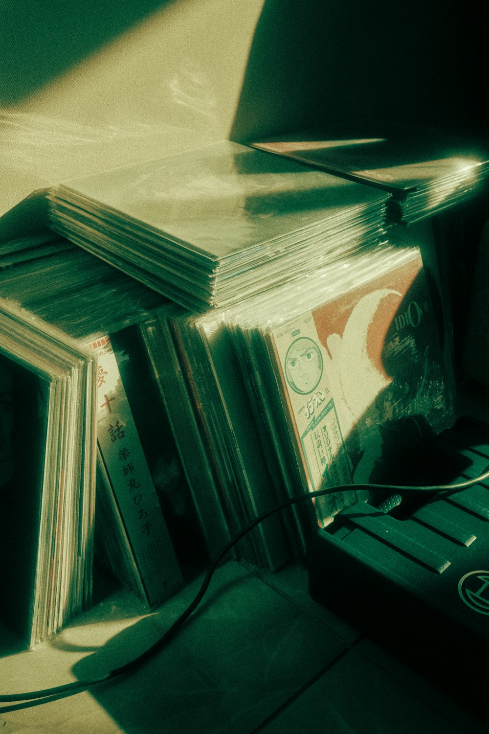 a stack of cds sitting on top of a table