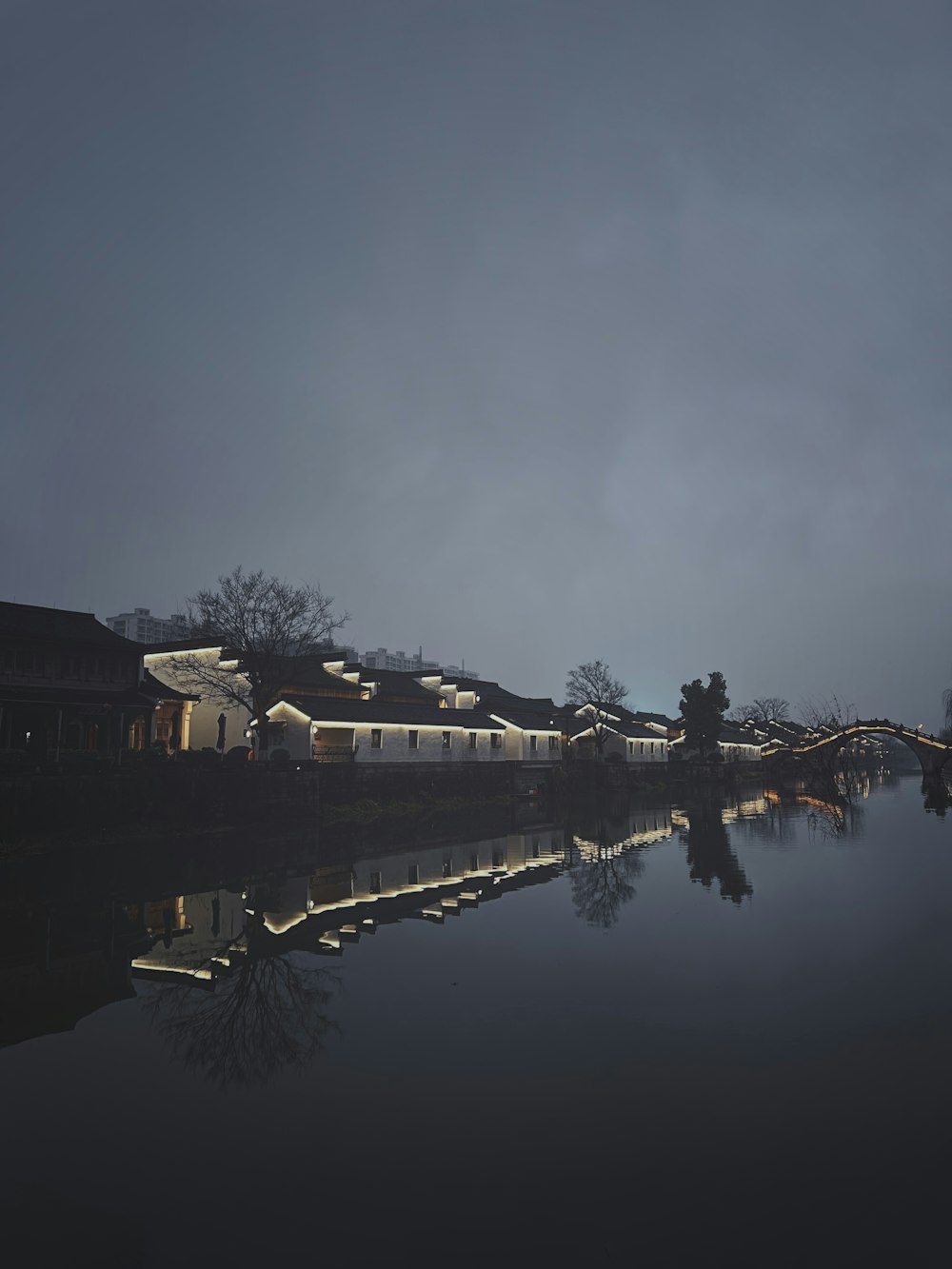 a train traveling down tracks next to a body of water