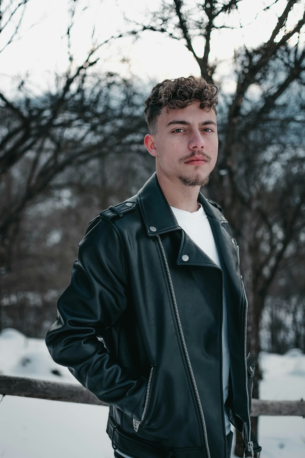 a man that is standing in the snow