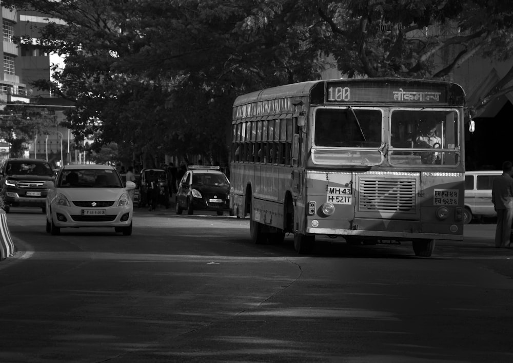 a black and white photo of a city bus