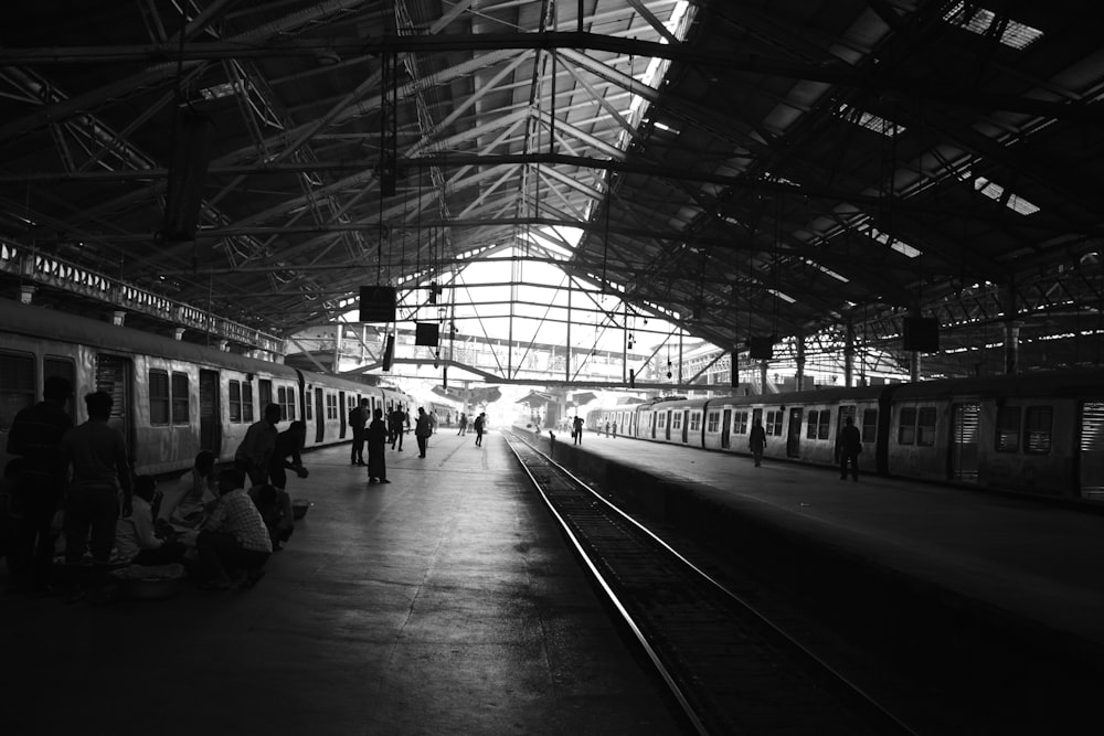 a black and white photo of a train station