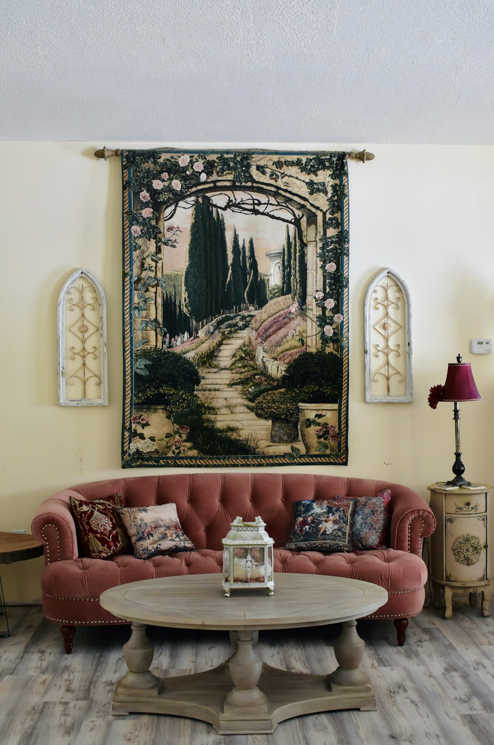 a living room filled with furniture and a painting on the wall