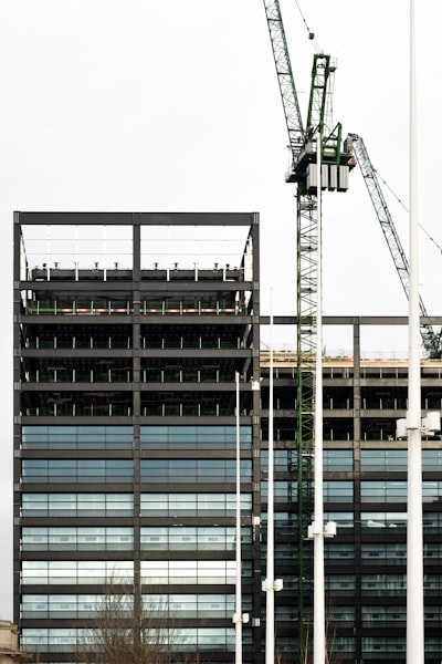 a crane is standing in front of a building