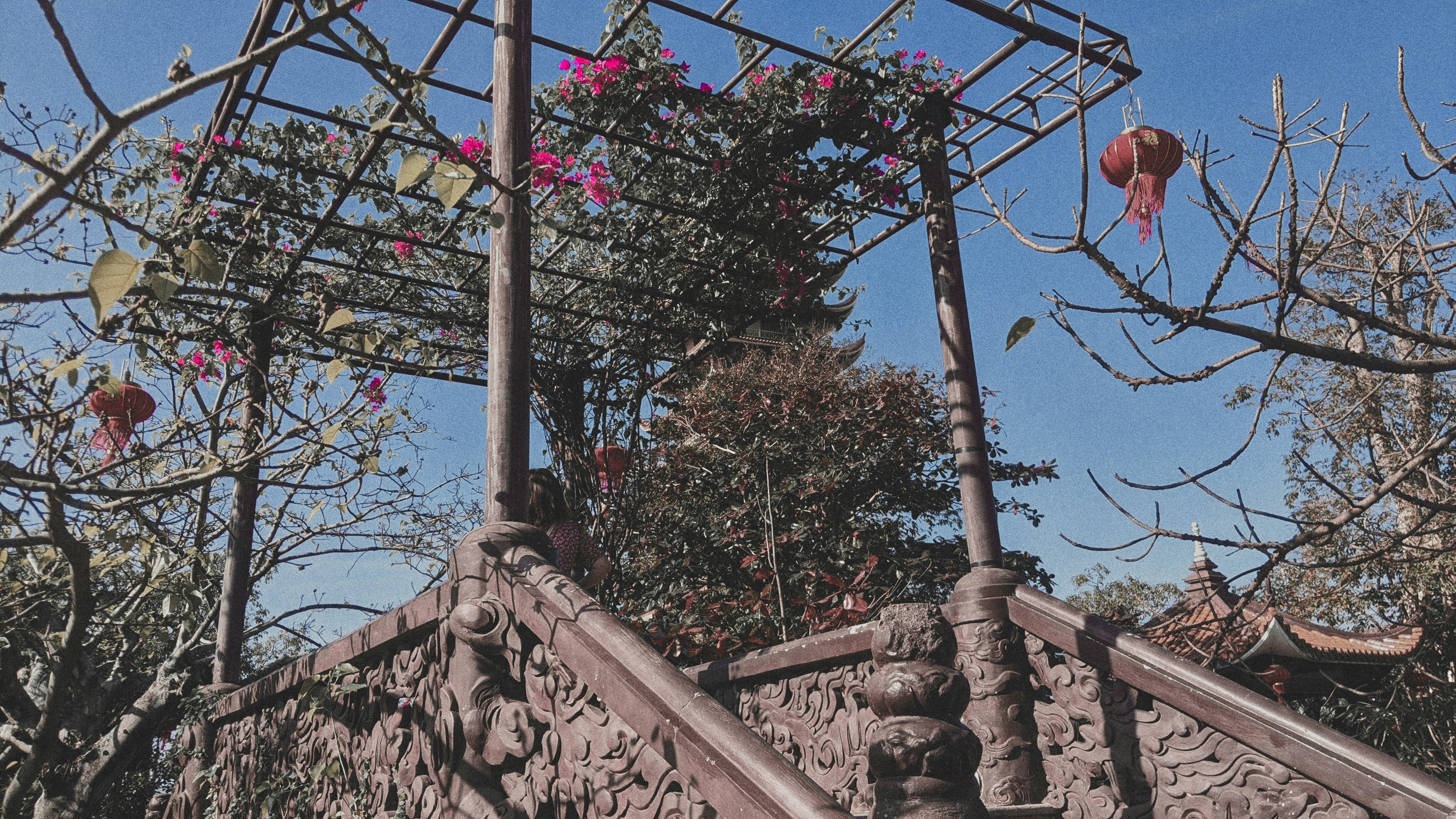 a set of stone steps with pink flowers on them