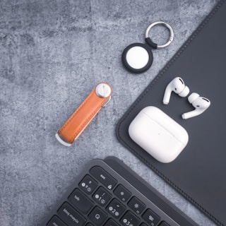 A creative flat lay of gmd earbuds with accessories.