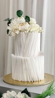 A multi-tiered cake with bold geometric shapes and gold accents.