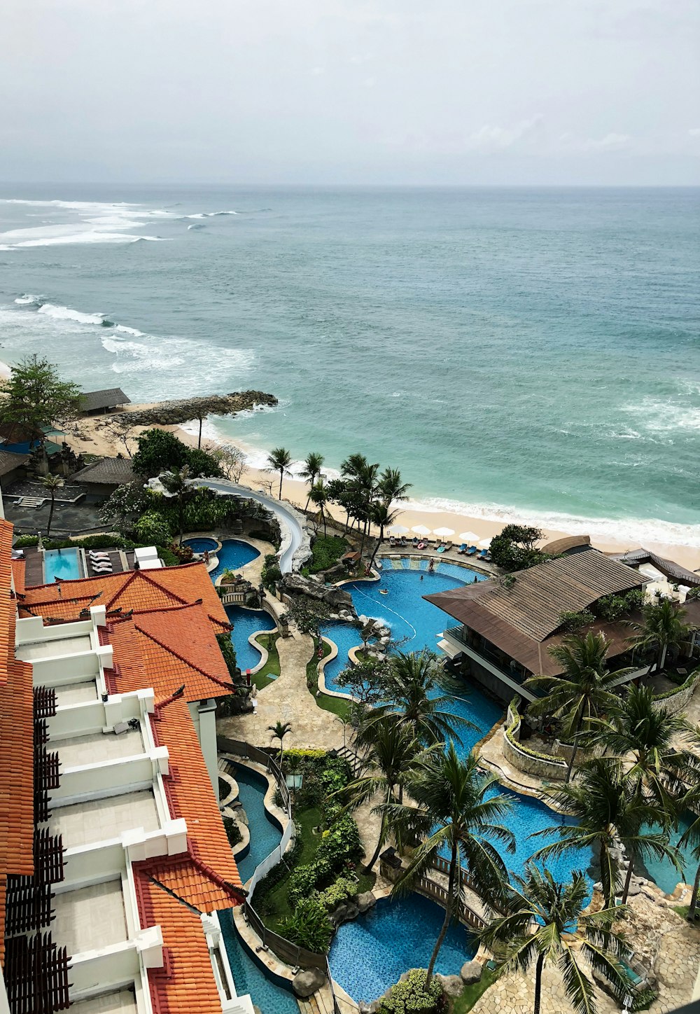 a view of a beach from a hotel room