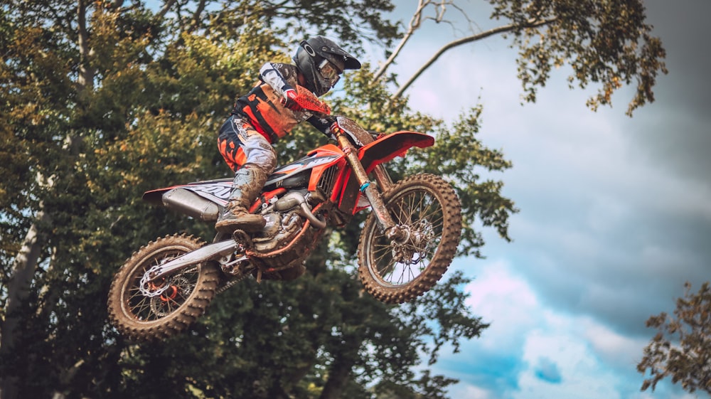 a person on a dirt bike in the air