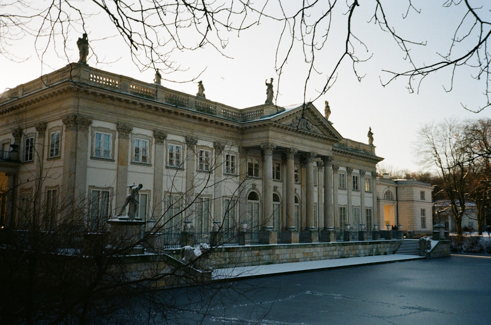 a large building with statues on top of it