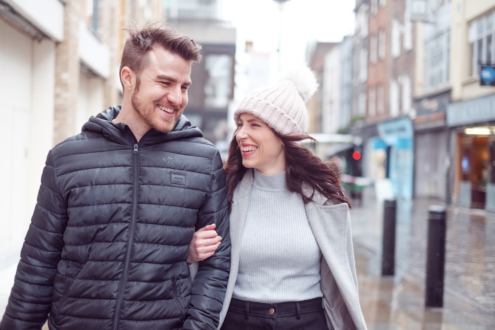 a man and a woman walking down a street