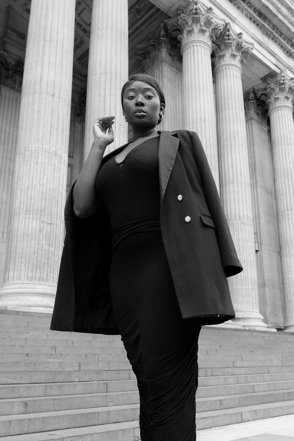 a woman standing in front of a building