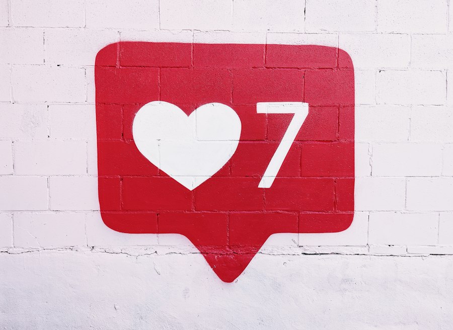 Red heart notification icon on a white wall