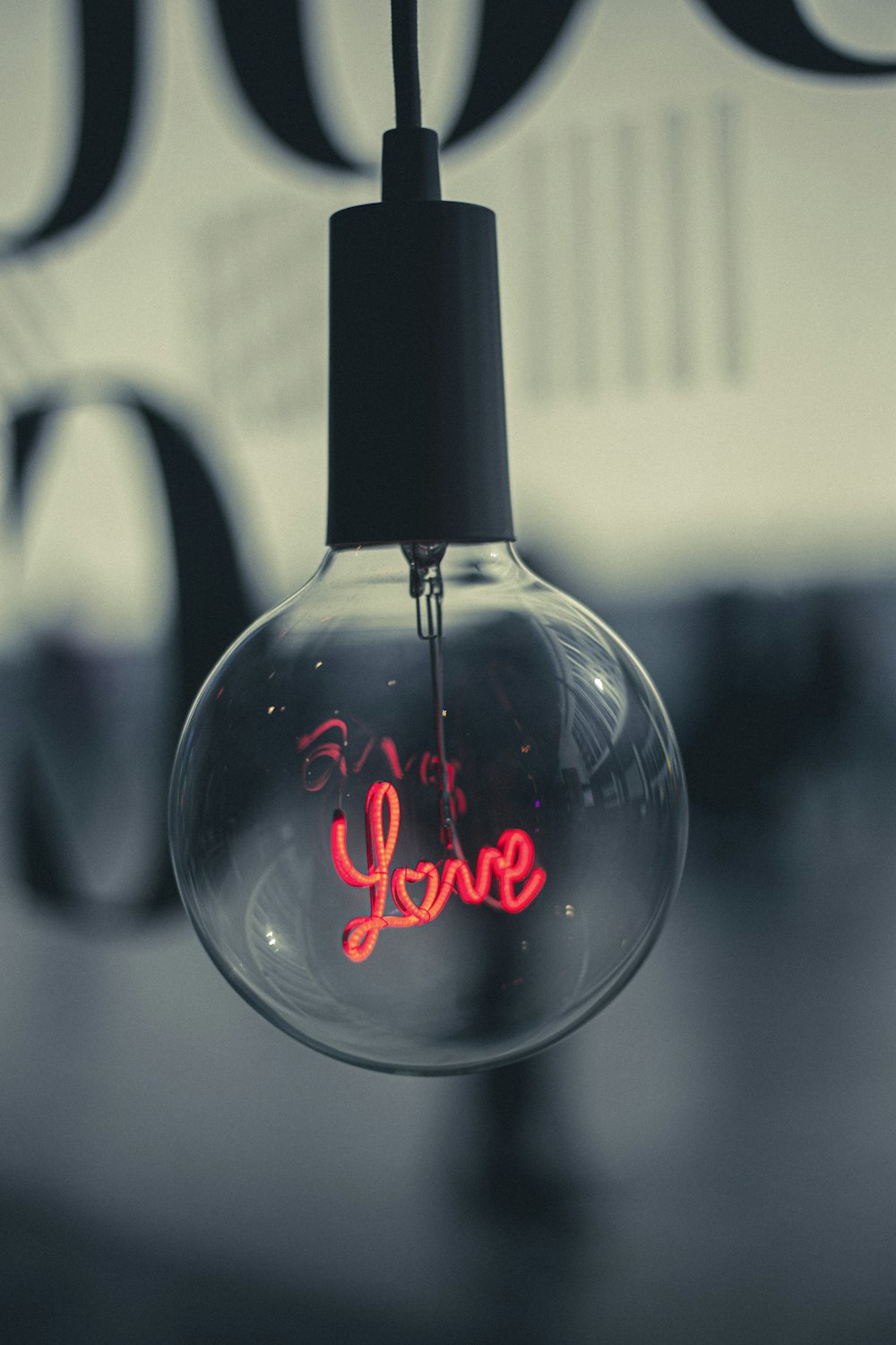 a light bulb with the word love written on it