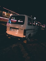 Emergency locksmith van parked on a city street at dusk.