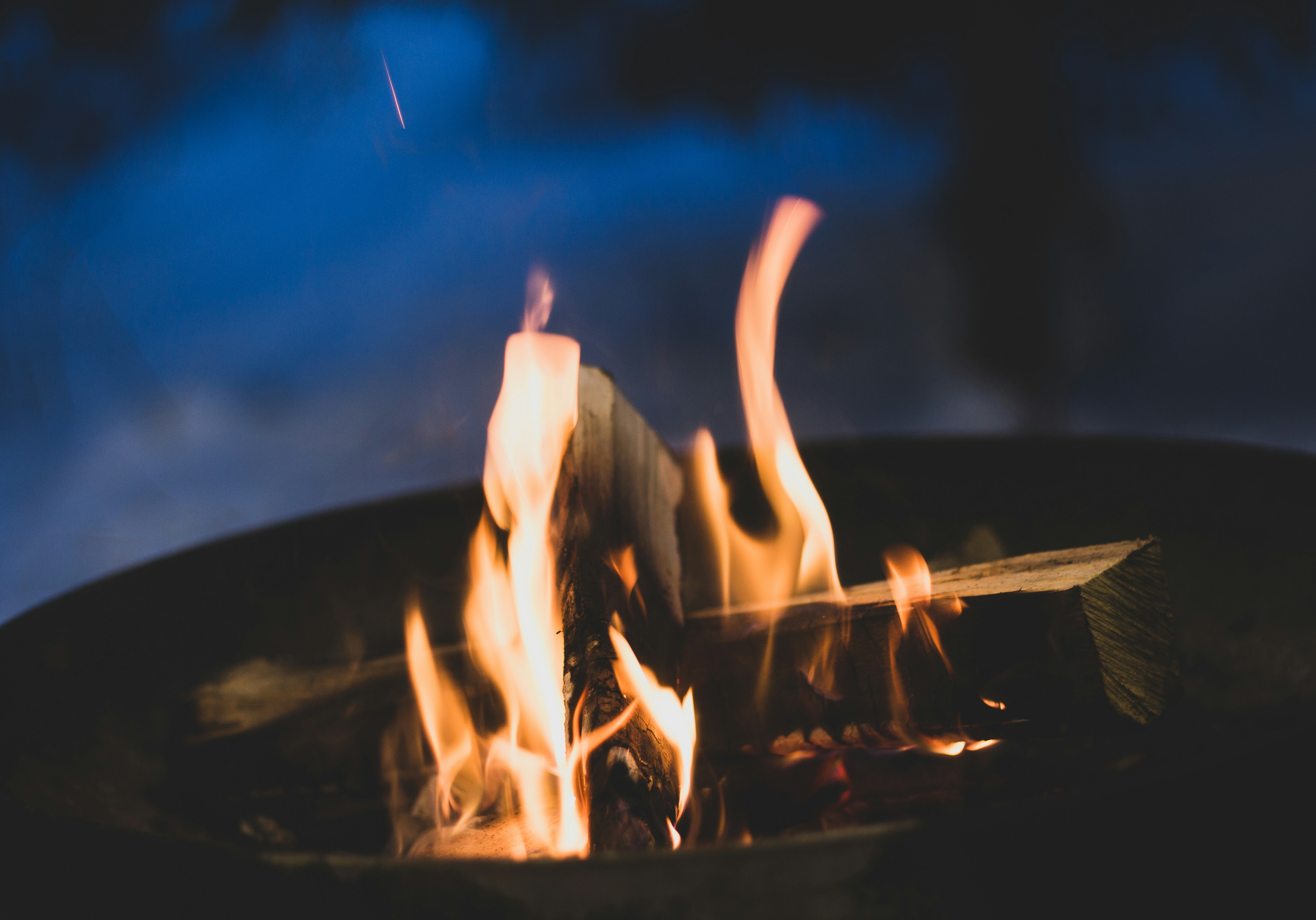 a close up of a fire in a metal bowl