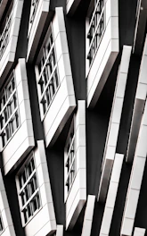 Modern aluminum door and window installation in a sleek black and gold themed home.