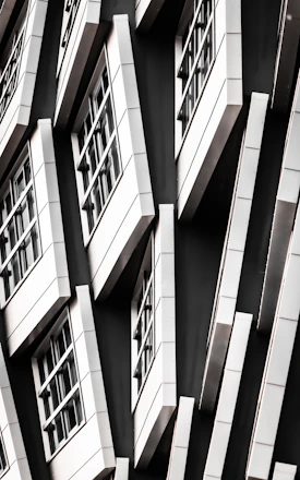 Modern aluminum door and window installation in a sleek black and gold themed home.