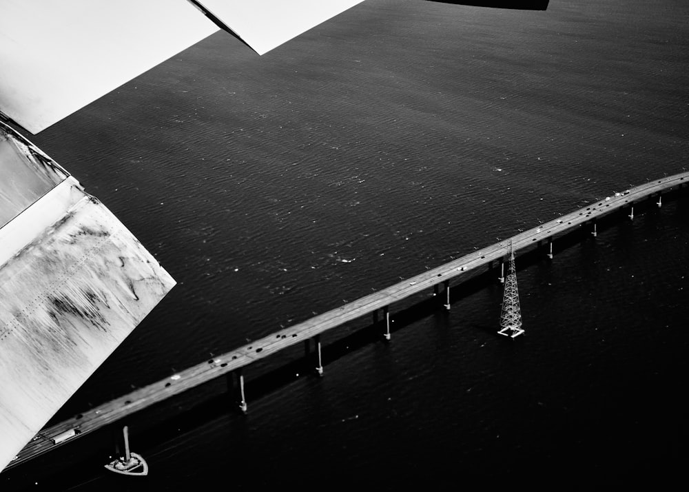 a black and white photo of an airplane wing