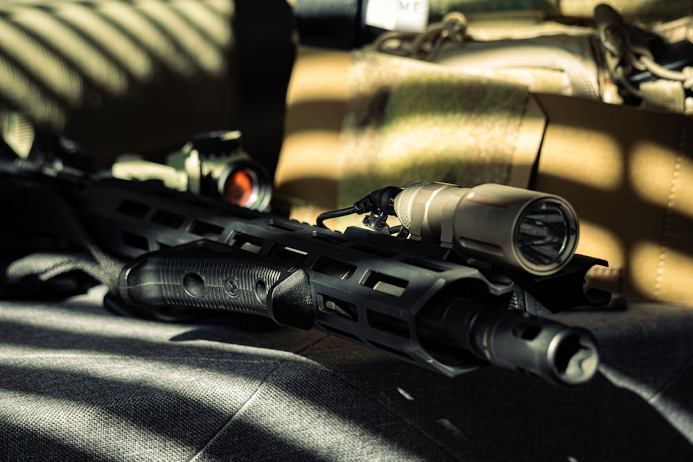 a close up of a rifle on a couch