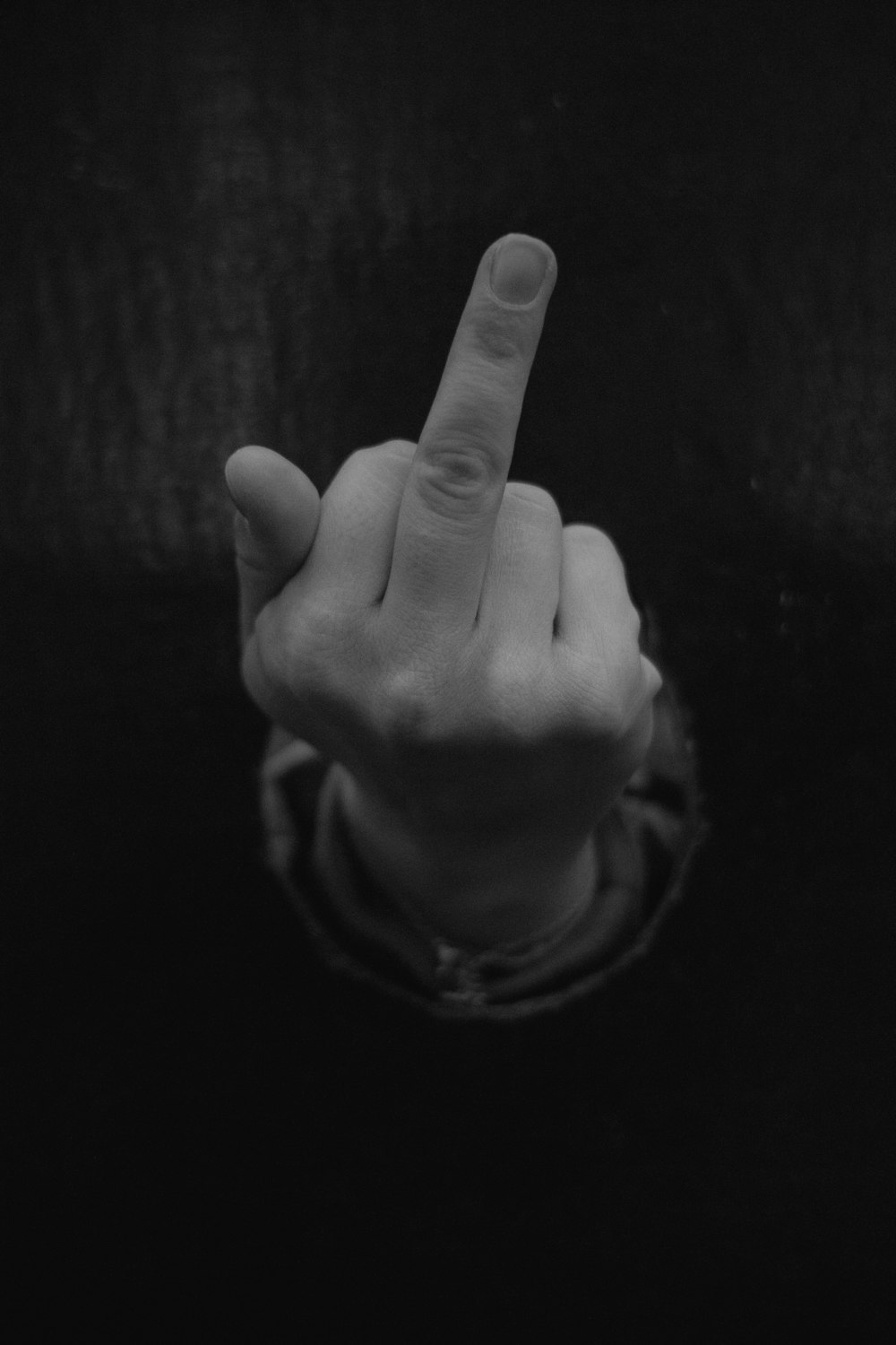 a person pointing a finger at the camera