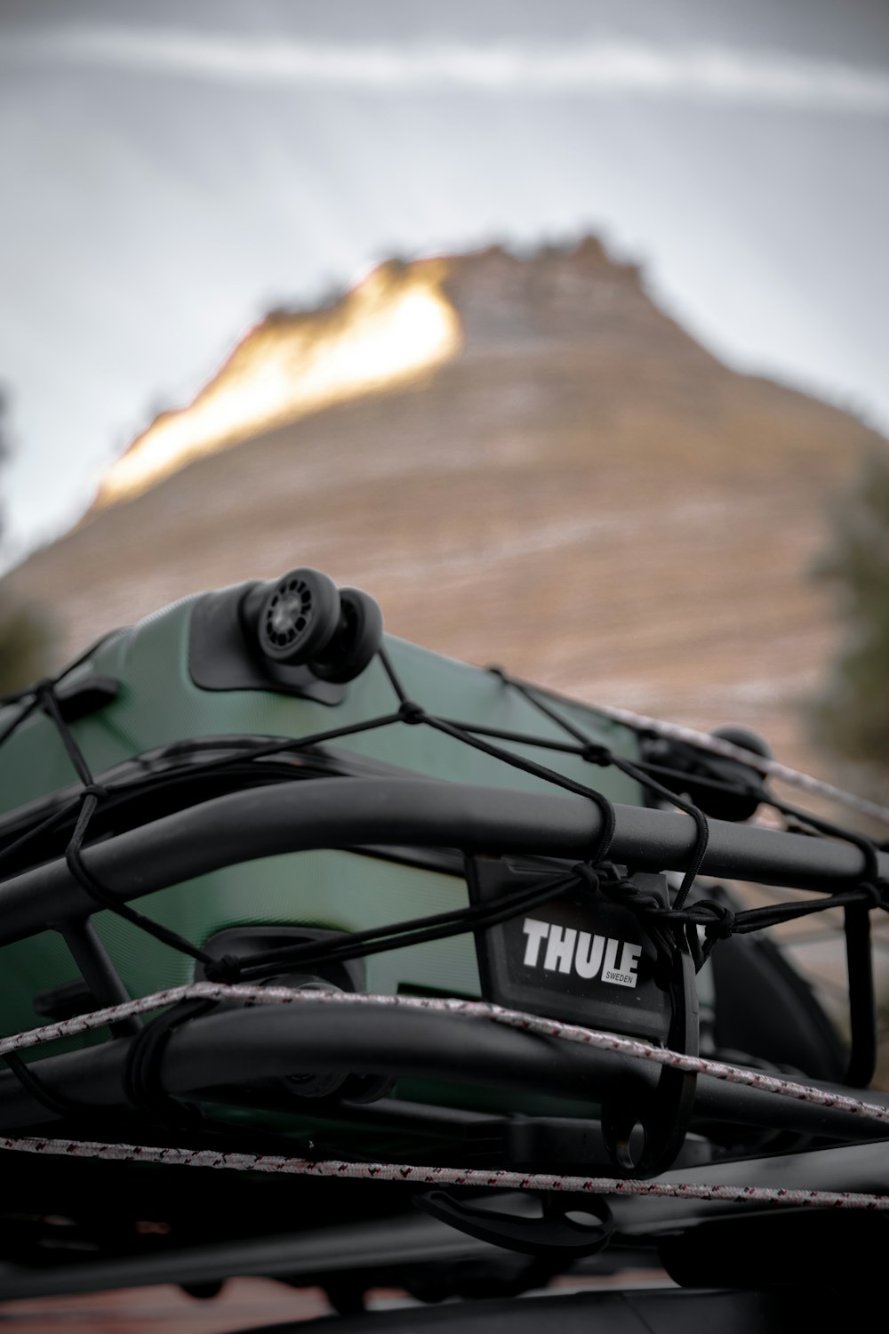 a close up of a boat with a mountain in the background