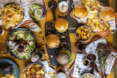 a wooden table topped with lots of food