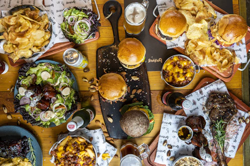 a wooden table topped with lots of food