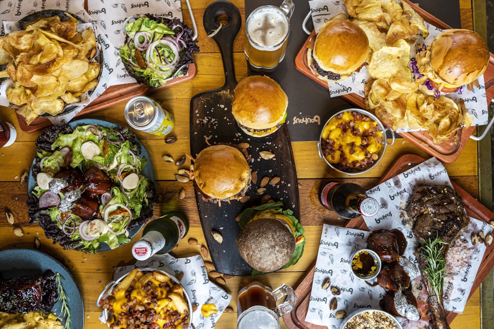 a wooden table topped with lots of food