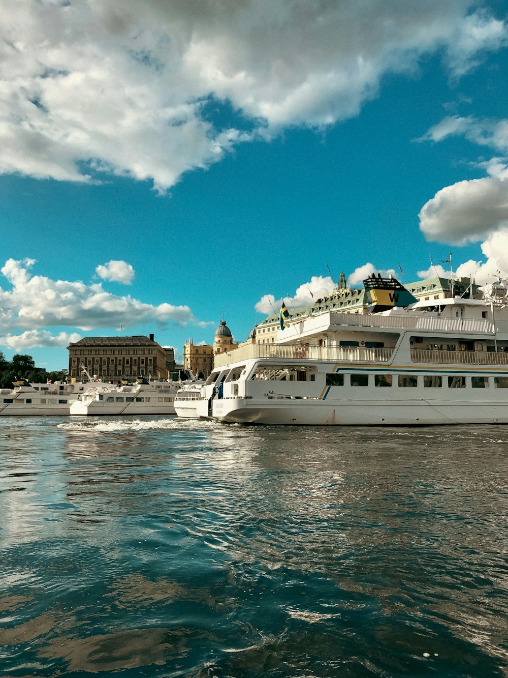 a large white boat floating on top of a body of water